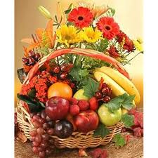 Fresh Fruit and assorted Flowers all in one basket