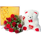 12 red roses+ celebration pack with teddy .