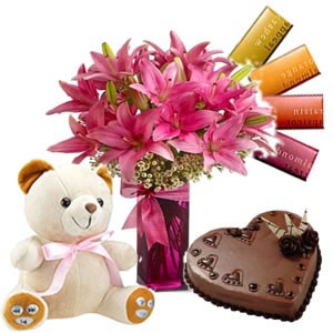 6 lilies vase, 4 temptation chocolates, 1/2 kg Cake, 6 inch teddy